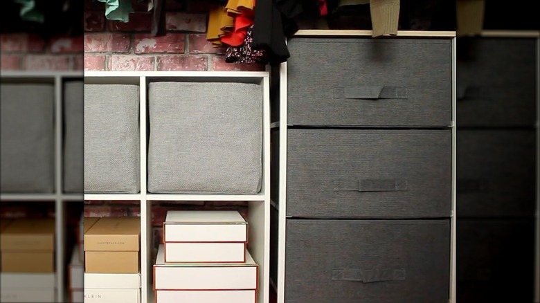 Fabric storage bins used in closet as drawers