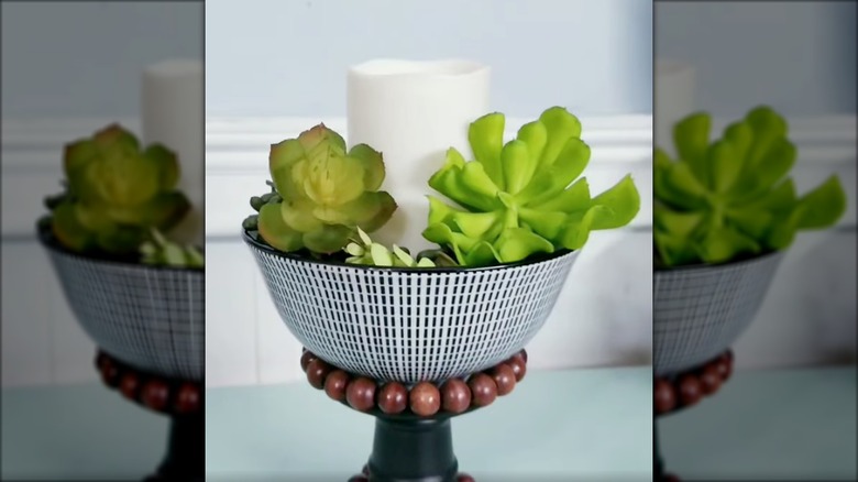 bowl repurposed into a candle holder on a table