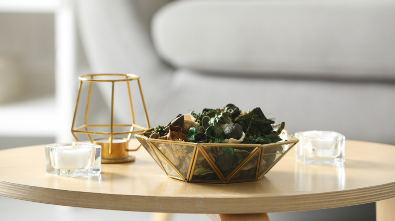 decorative accent bowl filled with potpourri on a coffee table