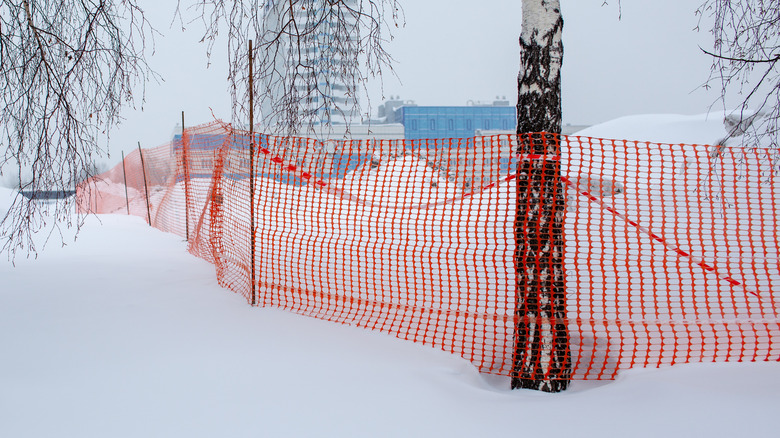Temporary plastic fence in snow