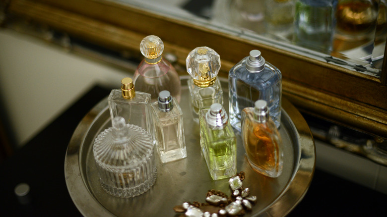 perfume bottles on metal cake stand