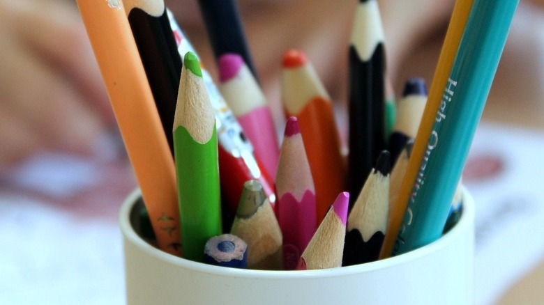 colored pencils in cup