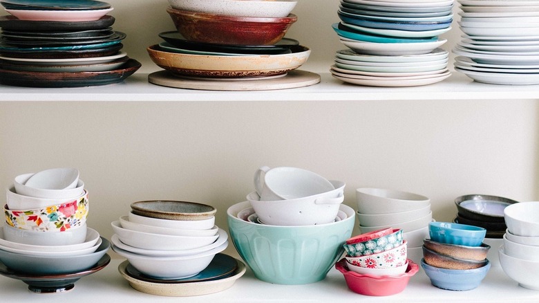 dishes stacked on shelves