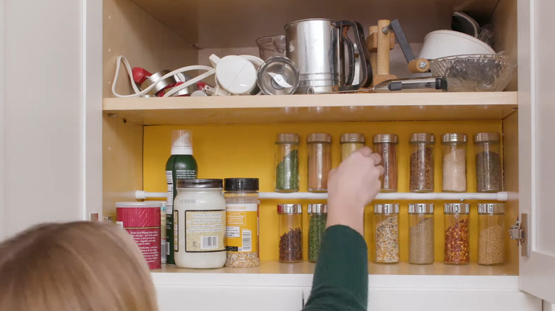 tension rod spice jars cabinet