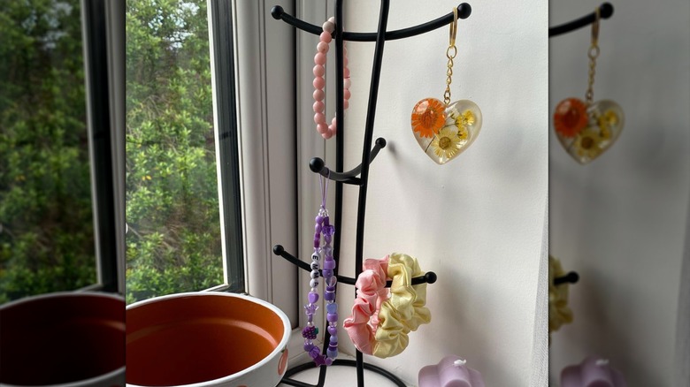 Jewelry and scrunchies on mug tree