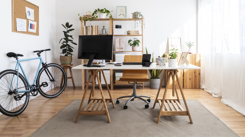 Home office with a wooden desk and chair