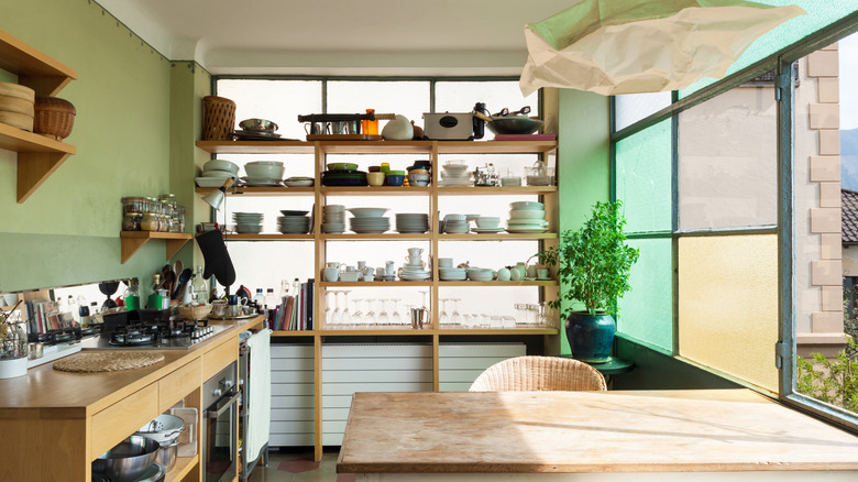 Kitchen with cluttered open shelving