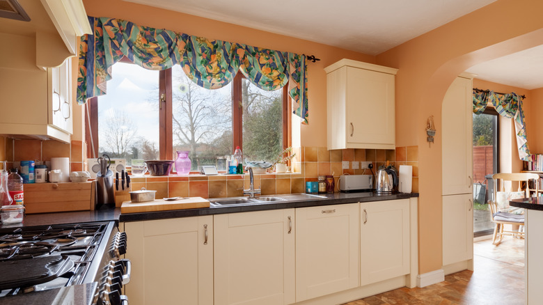 Kitchen with cluttered countertops