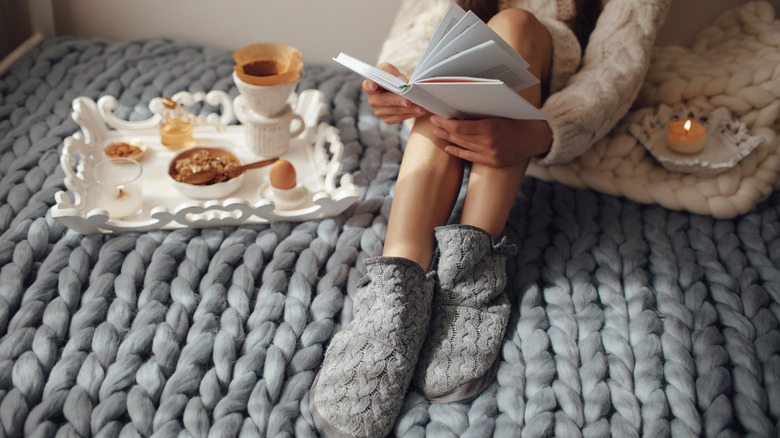 Woman reading in cozy space