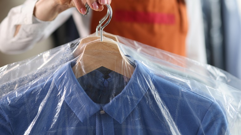 Close up of dry cleaning clothes in bags