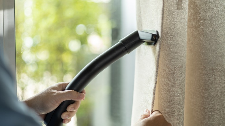 Using vacuum cleaner on curtain