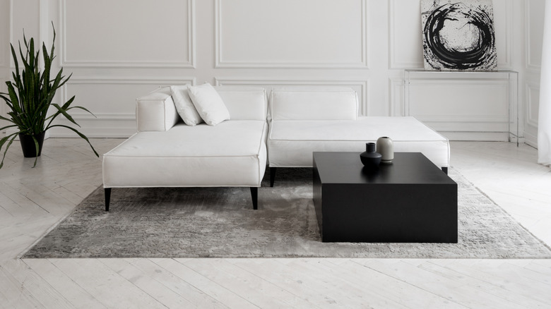 White leather chaise-end sofa in a minimalist living room