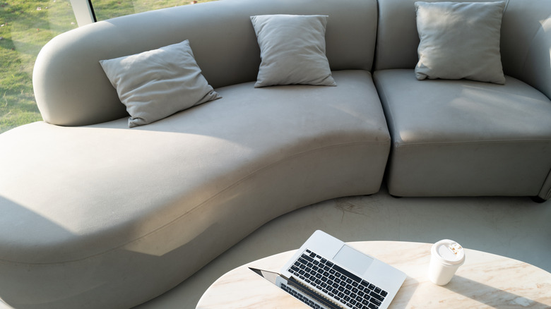 gray low-slung sofa with coffee table