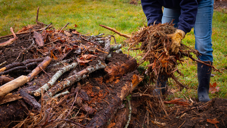 Creating a hugelkultur mound from logs and organic matter