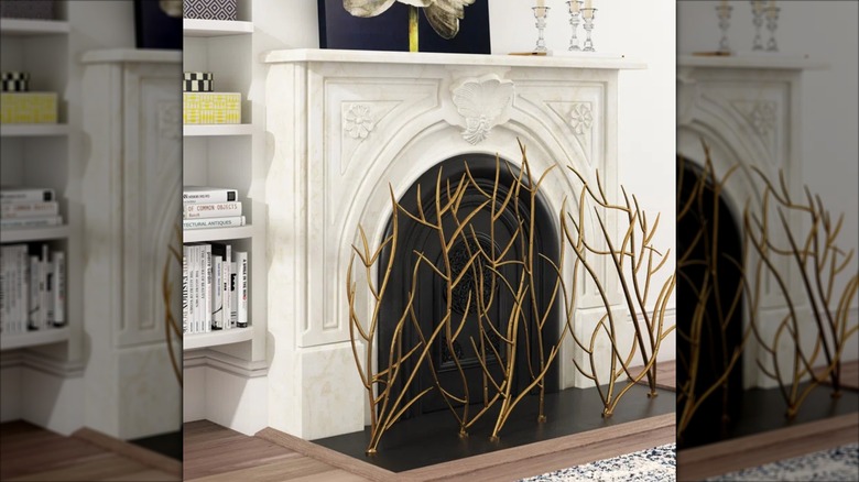 Elegant iron fireplace screen forged as tree branches