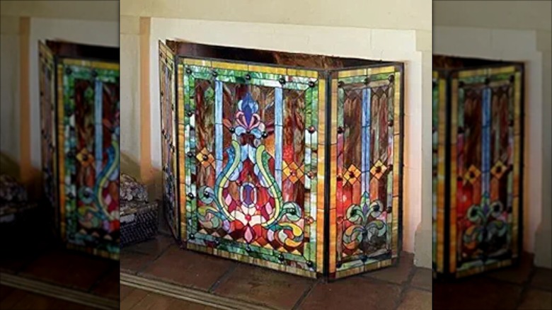 Fireplace screen with a colorful stained glass mosaic