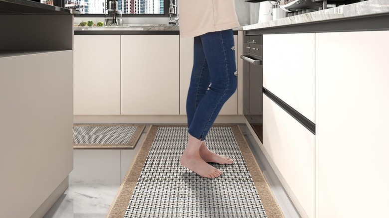 Textured woven runner in kitchen with a person in jeans standing at the stove