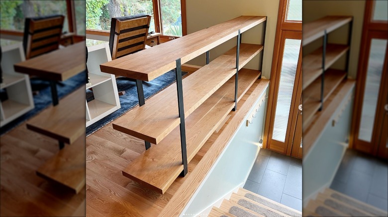 Bookshelves used to block stairs and entryway