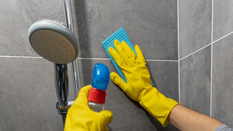 cleaning a shower wall