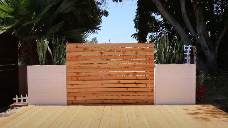 Wood fence with planters