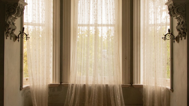 Lace curtains at dusk