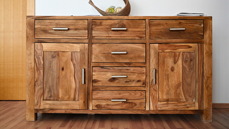 Stained wood console table with silver hardware