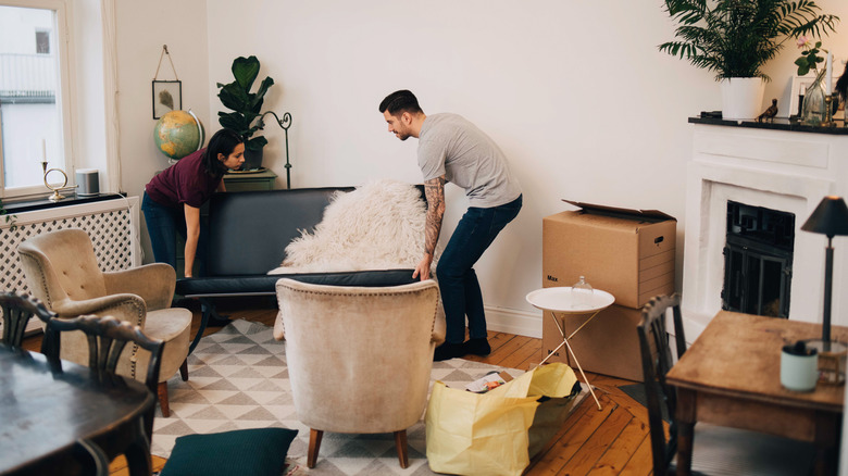 couple arranging furniture