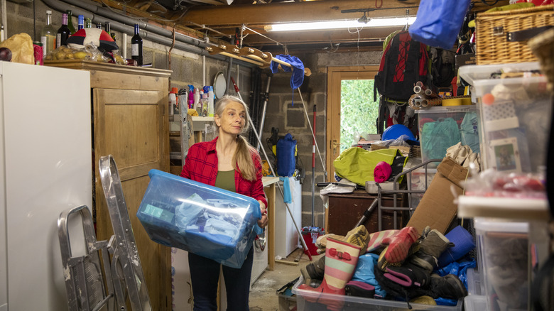 Woman gathering items from garage