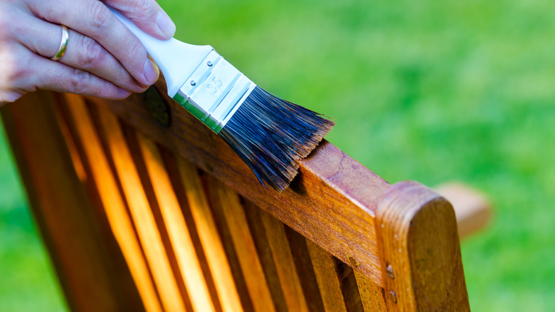 Applying varnish to furniture