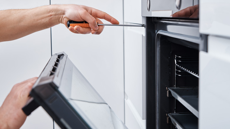 Person doing appliance repair