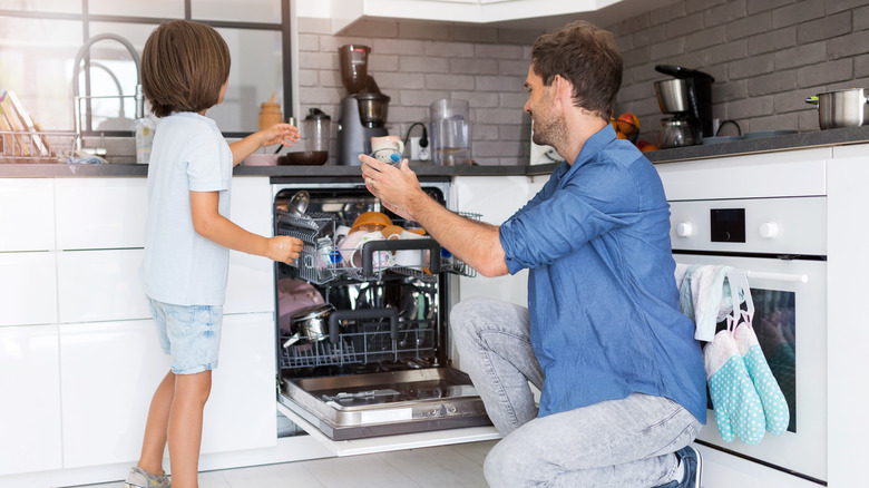 People loading dishwasher