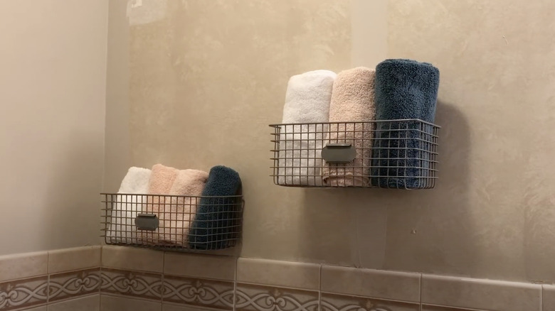 Customize your basket storage system to hold towels in the bathroom