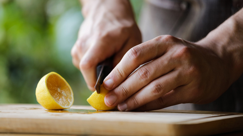 cutting a lemon in half