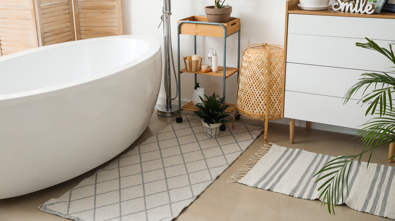 bathroom with rugs