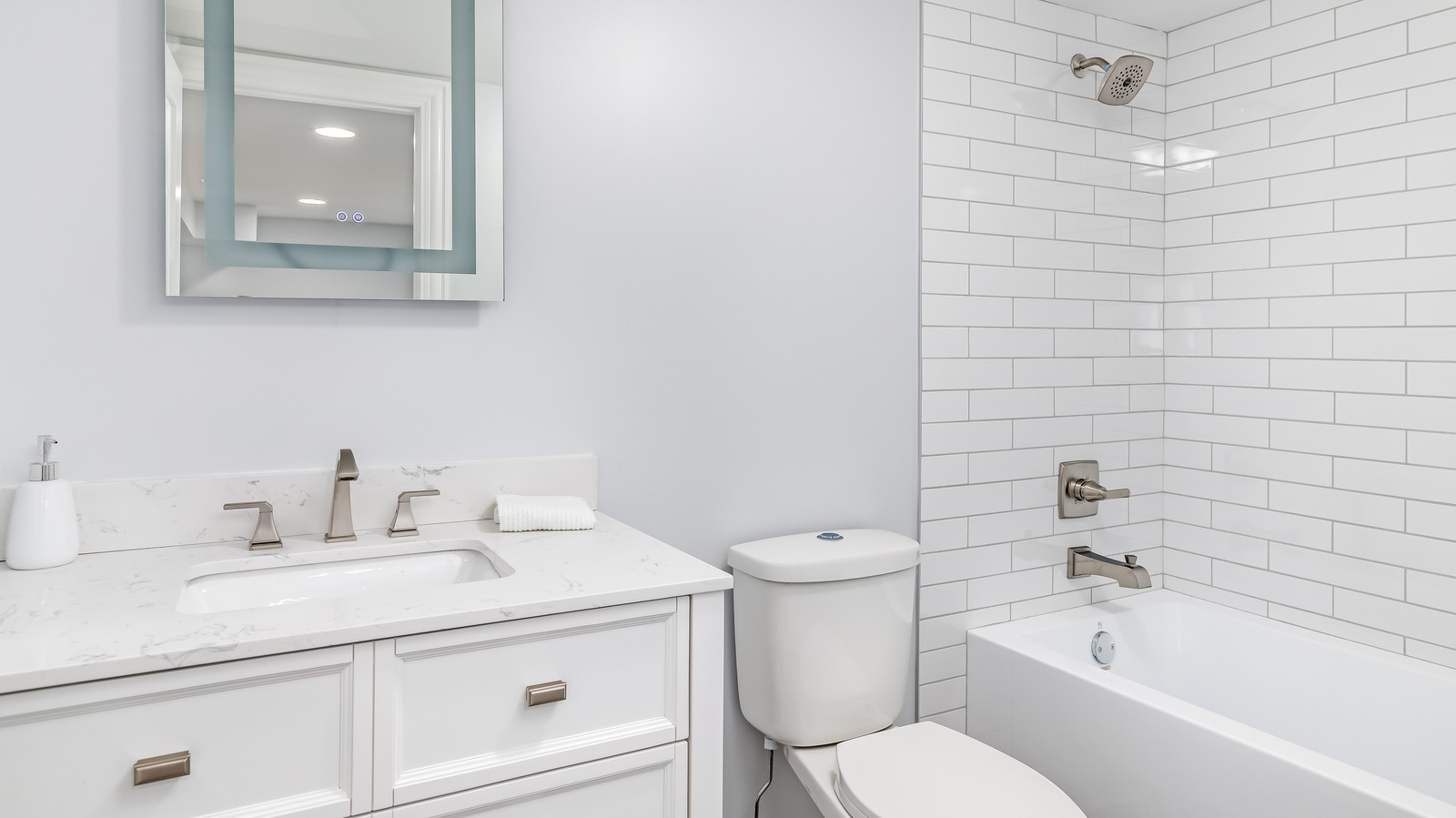 https://www.housedigest.com/img/gallery/a-design-expert-explains-how-to-add-warmth-to-your-all-white-bathroom/l-intro-1671794757.jpg