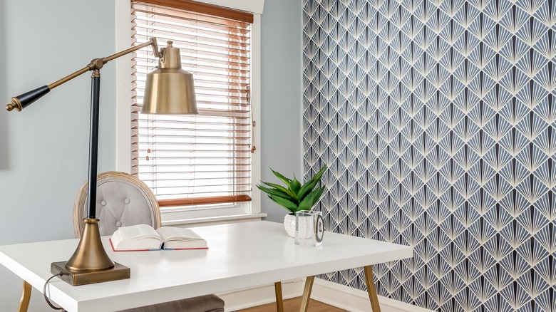 Home office with geometric wallpaper