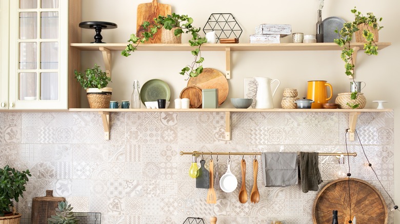 Open shelves over beige backsplash