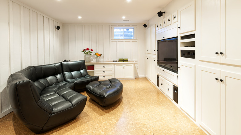 Cabinets surrounding TV with couch