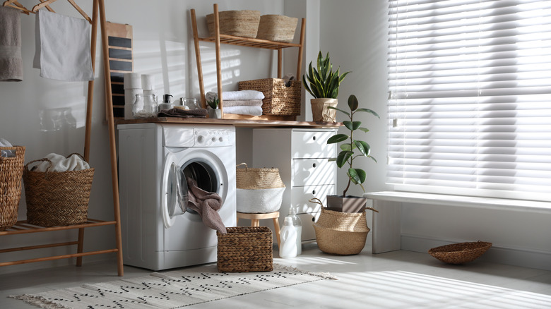 Laundry room with large window