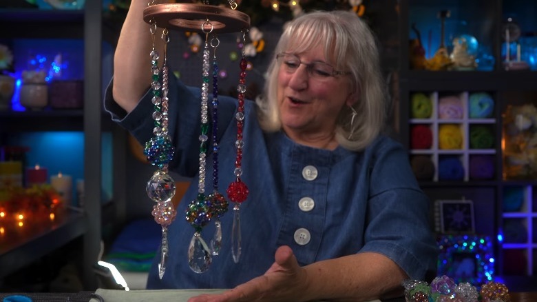 beaded suncatcher and woman