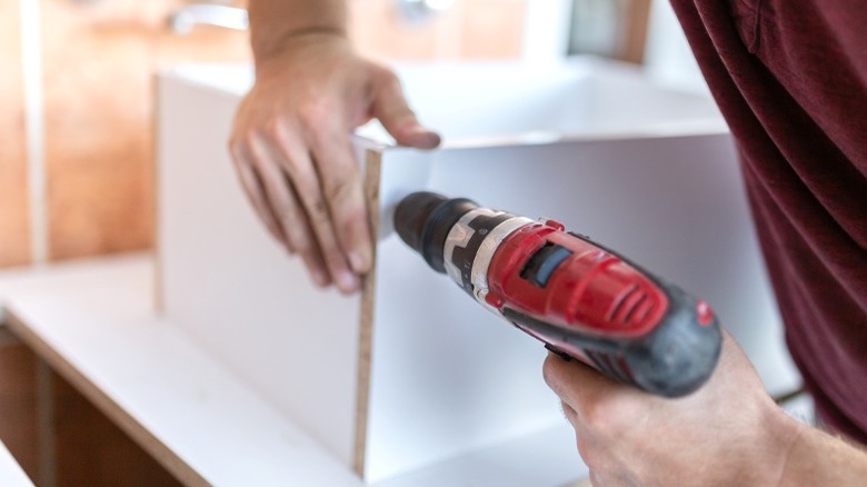 man drilling cube organizer