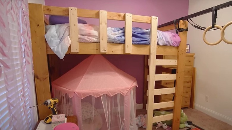 DIY wood loft bed in girl's bedroom