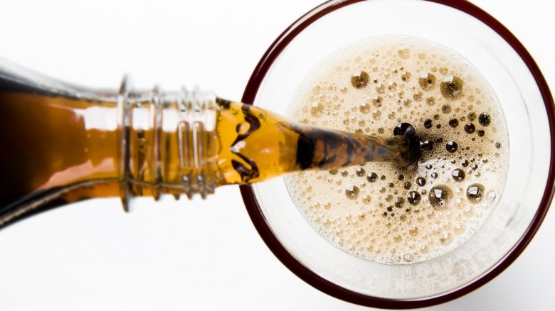 Pouring cola into glass