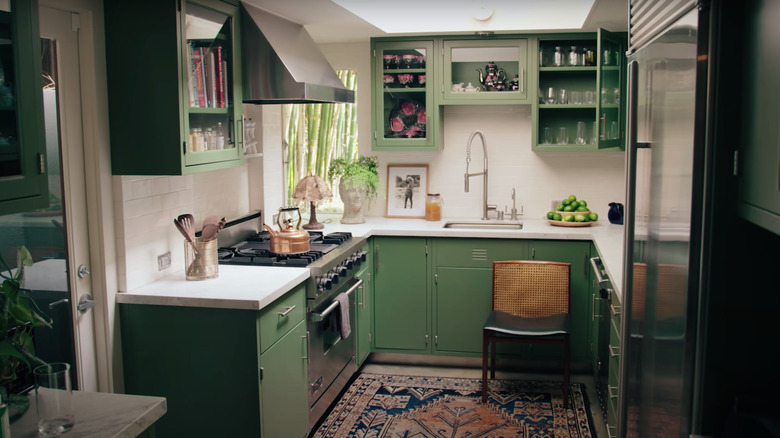 small kitchen with olive green cabinets