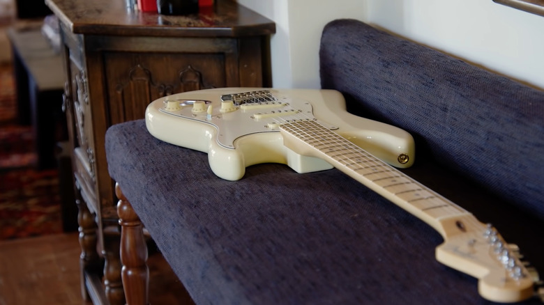 G-Eazy's guitar rests on a piece of furniture