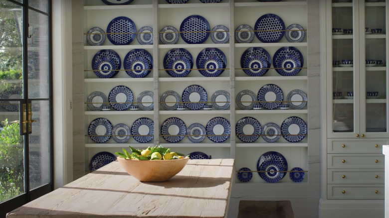 wall of plates in kitchen