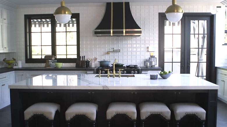 The black and white kitchen in Drew Scott and Linda Phan's home