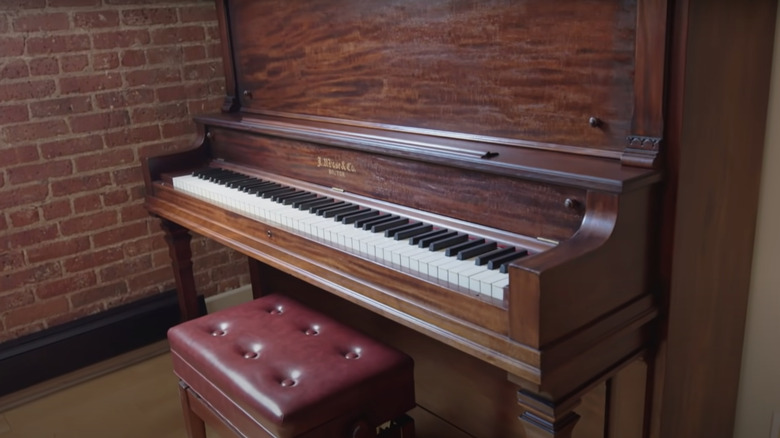 vintage upright piano in house