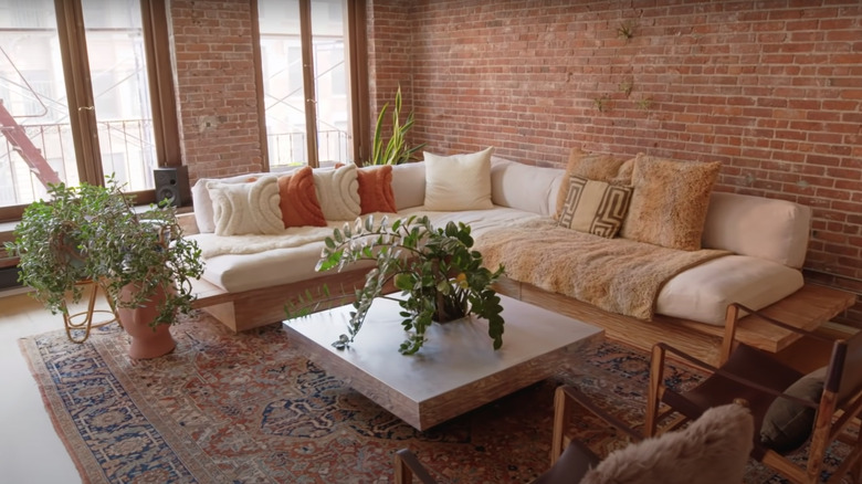 living room with brick walls