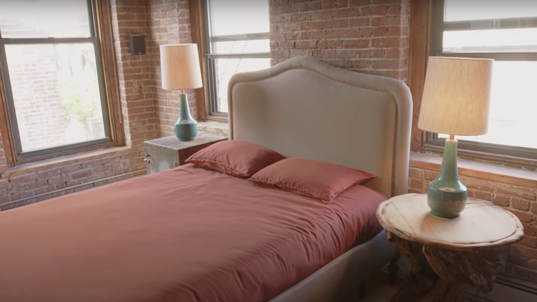 guest bedroom with pink sheets
